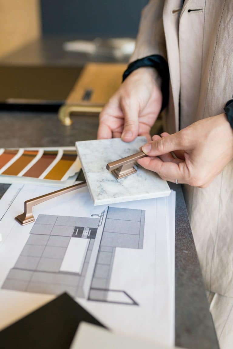 Designer woman choosing details of new kitchen in a home improvement store